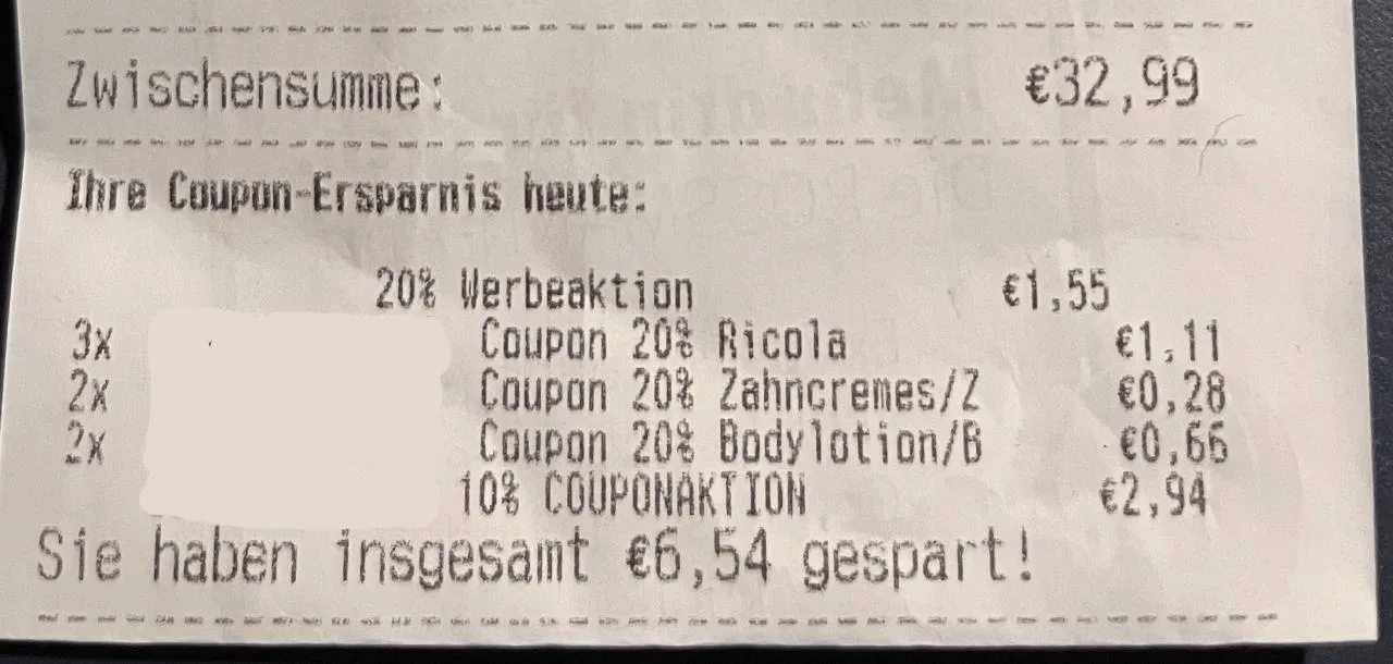 Mehrere Coupons und Ersparnisse werden aufgelistet. Insgesamt wurden 6,54 € gespart. Die Zwischensumme beträgt 32,99 €.